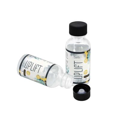 Bouteille d' huile essentielle en verre ronde de 30 ml pour les produits cosmétiques et de soins de la peau avec étiquette
