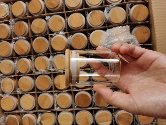 Bouteille en verre borosilicate résistant aux températures élevées avec couvercle d'aspiration en bois