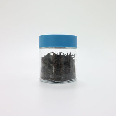 Un bocal en verre de 90 ml de capacité 3 oz avec un bouchon à vis pour enfants.